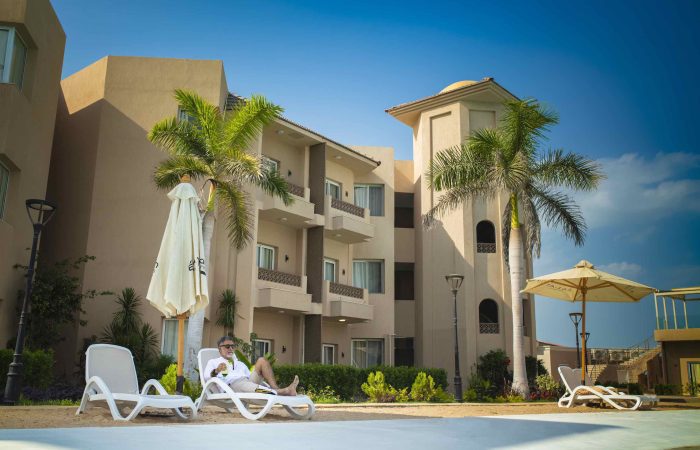 Relax in our Resort Family Suite with Swimmable Lagoon View, featuring full amenities for families and friends.